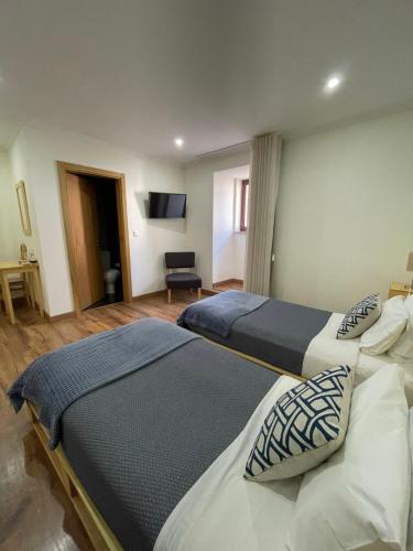 Ένα ή περισσότερα κρεβάτια σε δωμάτιο στο Casa Dona Eufémia