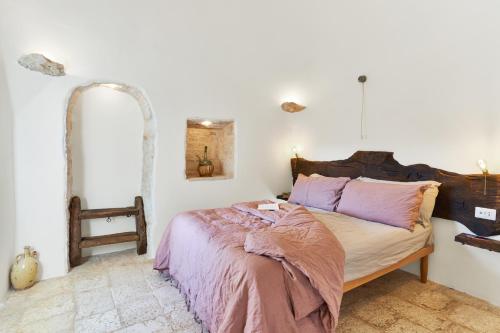 Postel nebo postele na pokoji v ubytování Trulli OraziO