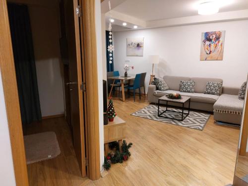 a living room with a couch and a table at Apartman Blago Zlatibora in Zlatibor