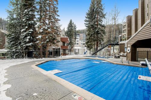 a large blue swimming pool in a building at Iron Horse Studio Retreat in Winter Park