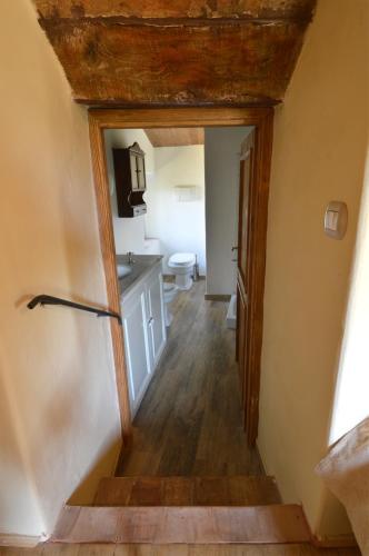 a hallway leading to a kitchen in a house at La Cannara in Marta