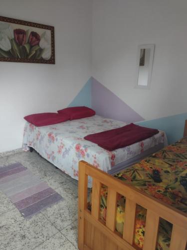 Llit o llits en una habitació de Suítes em Ubatuba