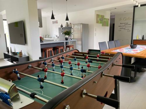 a conference room with a table and a billiard sidx sidx sidx at Le Gallus in Boersch