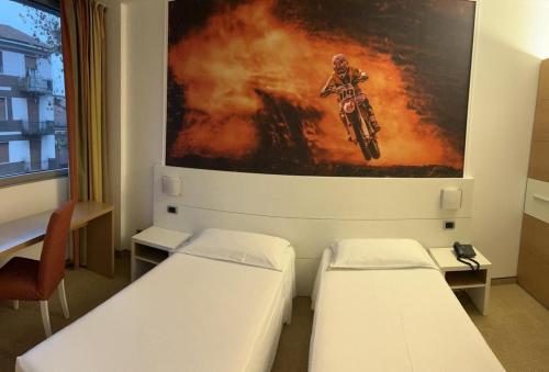 Cama o camas de una habitación en Hotel Sporting Brugherio