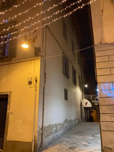 an alley with lights on the side of a building at Maestra Exclusive Chianti House, Tuscany in Poggibonsi
