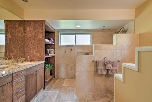 a bathroom with a shower and a sink at Waikoloa Village Condo with Pool and Golf Course Views in Waikoloa