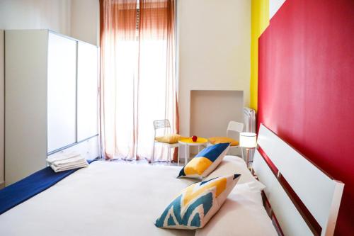 a bedroom with a bed with two pillows on it at Materdays 24 in Naples