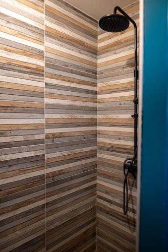 a bathroom with a shower with a glass door at logement entier au calme in Étercy