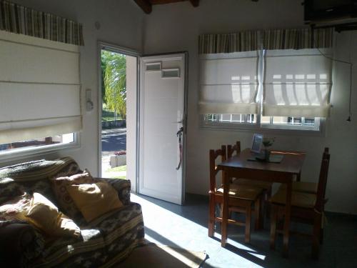 a living room with a couch and a table at El Zohar 4 pax in Federación