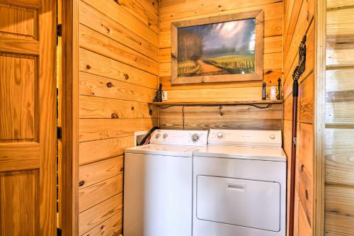a laundry room with a washer and dryer at Hot Springs Cabin Rental 2 Mi to Lake Hamilton! in Hot Springs