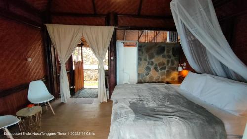 Postelja oz. postelje v sobi nastanitve Kelimutu Paradiso Resort