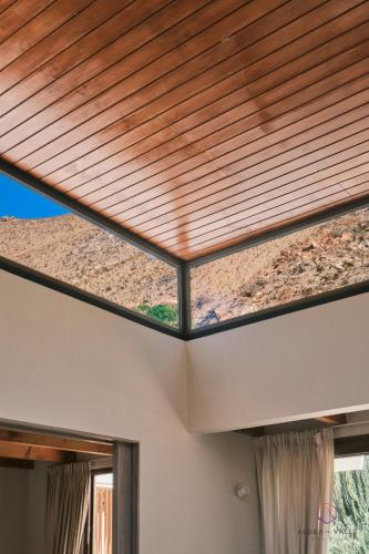 a wooden roof on a house with windows at Aldea del Valle - Elqui Villas, Pisco Elqui in Pisco Elqui
