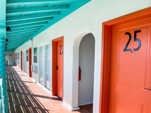 a row of colorful doors on a building at Taos Motor Lodge in Taos
