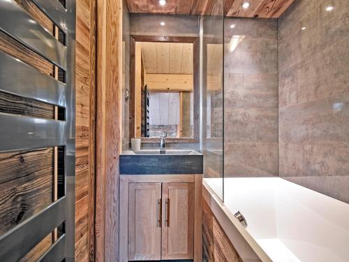 a bathroom with a sink and a shower at Duplex confortable avec conciergerie à Méribel - FR-1-613-9 in Méribel