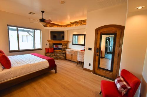 a bedroom with a bed and a living room at Peppertree Lane Ranch -- Seven-Acre Ranch in the Heart of Wine Country in Temecula