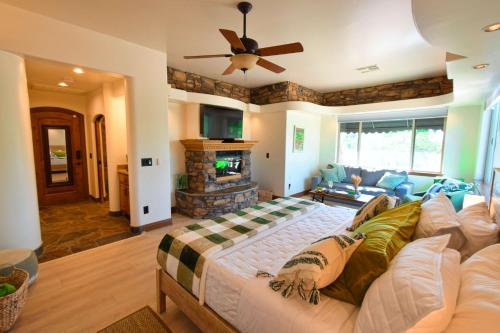 a living room with a couch and a fireplace at Peppertree Lane Ranch -- Seven-Acre Ranch in the Heart of Wine Country in Temecula