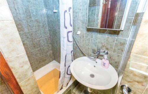 a bathroom with a sink and a shower at Cozy Apartment In Crikvenica With Wifi in Crikvenica