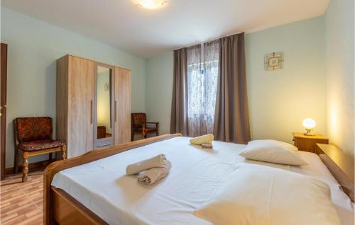 A bed or beds in a room at Nice Home In Kucice With Wifi