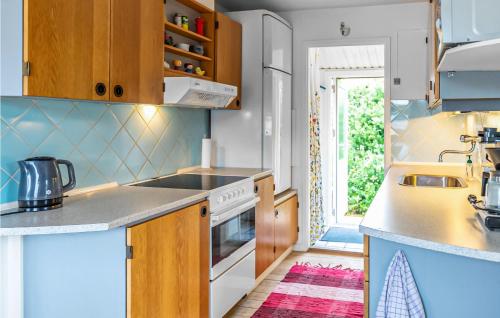 a kitchen with a sink and a stove top oven at Holiday Home Olymposvej in Slagelse