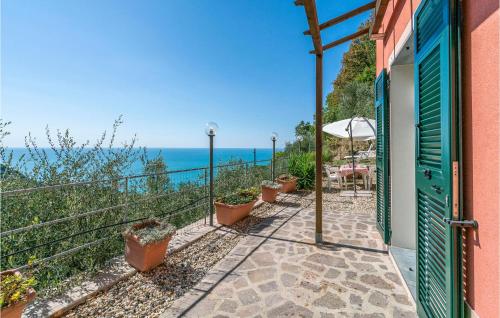 a patio with a view of the ocean at La Casa Rossa in Framura