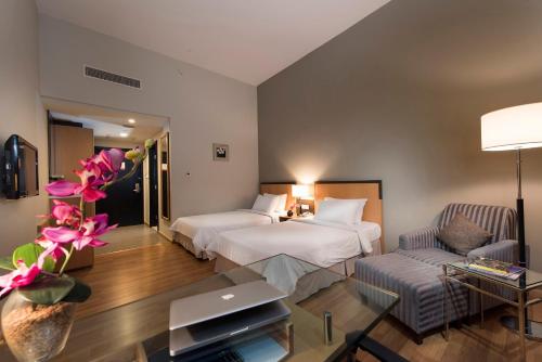 Postel nebo postele na pokoji v ubytování Kingwood Hotel Sibu