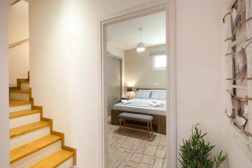 a bedroom with a bed and a mirror in a room at Alia House in Doukádes