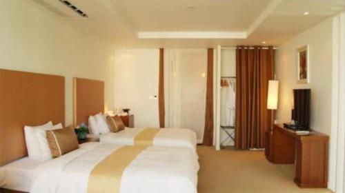 Ένα ή περισσότερα κρεβάτια σε δωμάτιο στο Ecograd Hotel