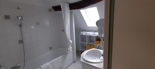 a small bathroom with a toilet and a window at Le Nid de l'Ecureuil in Selles-sur-Cher