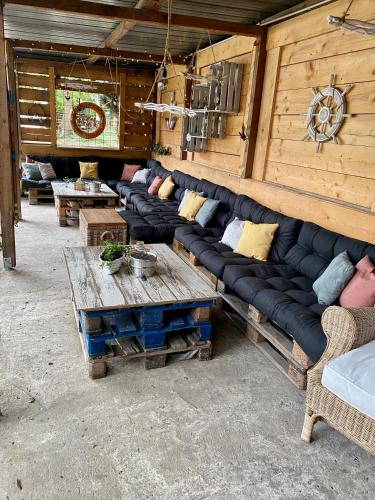 a living room with a couch and a table at Tiny House Ahse im PIER9 Tiny House Hotel in Hamm
