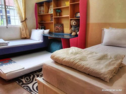 Katil atau katil-katil dalam bilik di Homestay Anjung Malinja Private Pool Kedah