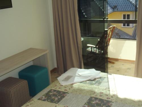 Ένα ή περισσότερα κρεβάτια σε δωμάτιο στο Hotel Park Haus