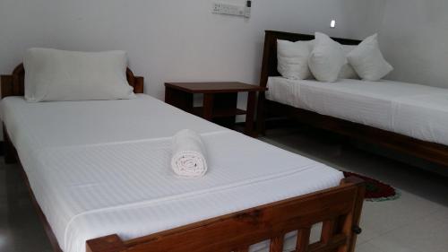 Postel nebo postele na pokoji v ubytování Butterfly Homestead Hotel