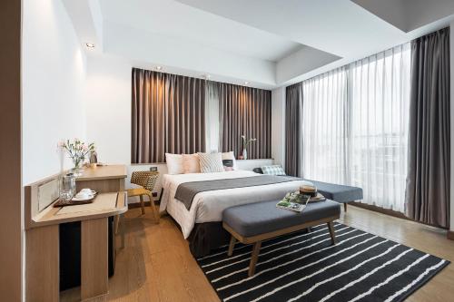 Giường trong phòng chung tại Darley Hotel Chiangmai