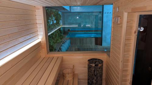 an inside view of a sauna with a swimming pool at "The House" Апартаменти и Термална зона in Velingrad