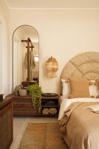 a bedroom with a large mirror and a bed at Tenuta Negroamaro in Gallipoli