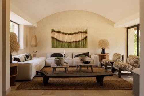 a living room with a white couch and a table at Tenuta Negroamaro in Gallipoli