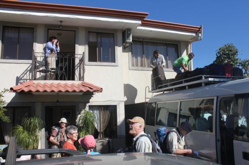 a group of people standing outside of a building at Hotel Santa Maria Inn in Alajuela City
