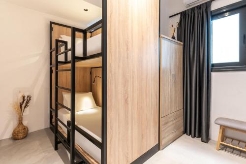 a room with bunk beds in a hostel at PAME Wild in Athens