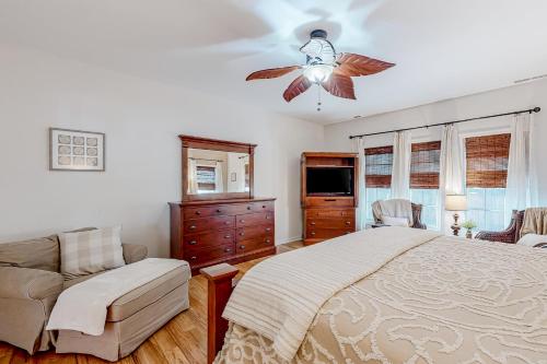 a bedroom with a bed and a ceiling fan at Breezewood 139 Whisperwood Ln in Rehoboth Beach