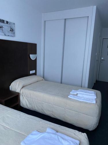 Ένα ή περισσότερα κρεβάτια σε δωμάτιο στο Hostal La Pinilla