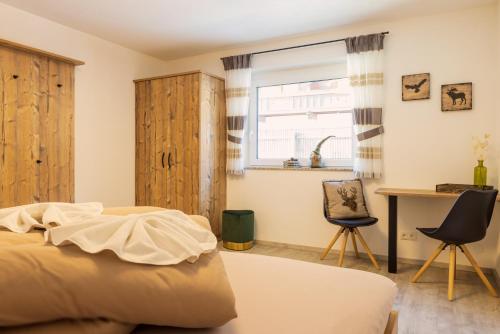 Ein Bett oder Betten in einem Zimmer der Unterkunft Apartments Mooshof