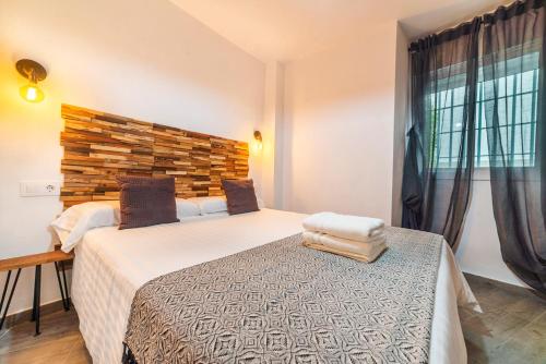 A bed or beds in a room at Alohamundi Molino