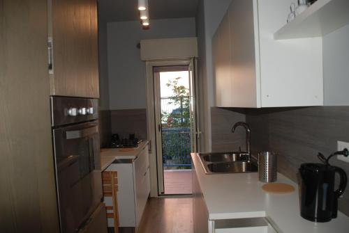 a kitchen with a sink and a counter top at Casa Il Delfino in Aci Castello