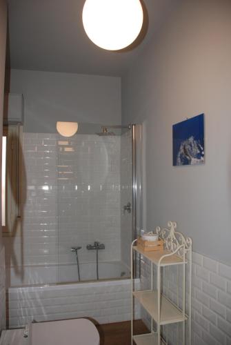 a bathroom with a shower and a toilet and a sink at Casa Il Delfino in Aci Castello