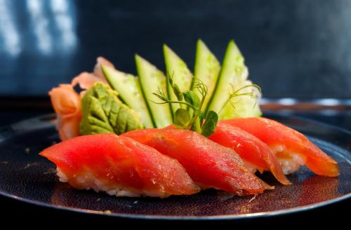 a plate with three different types of food on it at Southern Sun Abu Dhabi in Abu Dhabi