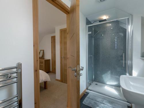 a bathroom with a shower and a sink at Springbank in Eyre