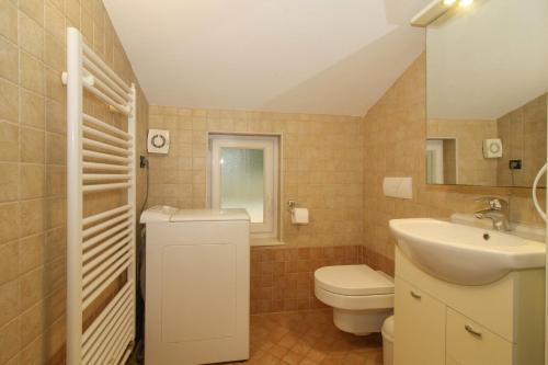a bathroom with a toilet and a sink at Bruk in Lovran - Kvarner Region in Lovran