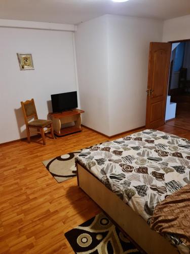 Katil atau katil-katil dalam bilik di Pensiunea Dumbrăvița