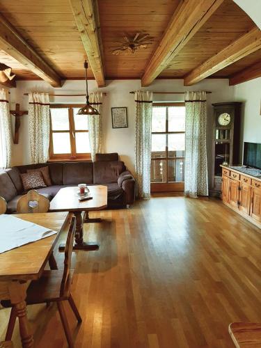 a living room with a couch and a table at Ferienhaus Piller in Viechtach