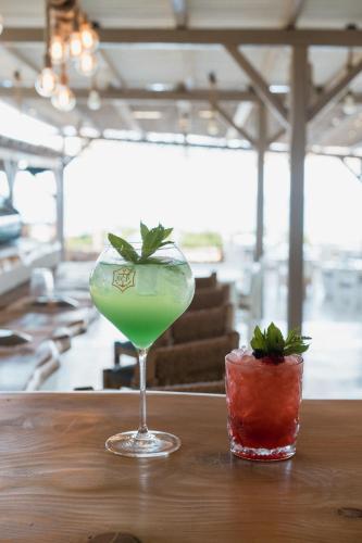 a margarita and a drink on a table at Soros Beach Antiparos in Agios Georgios